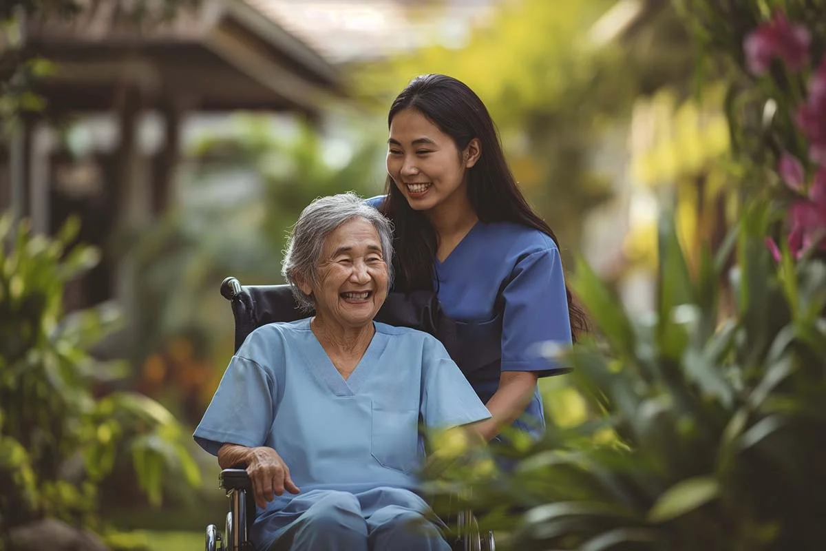 Happy senior client enjoying outdoor companionship with compassionate caregiver